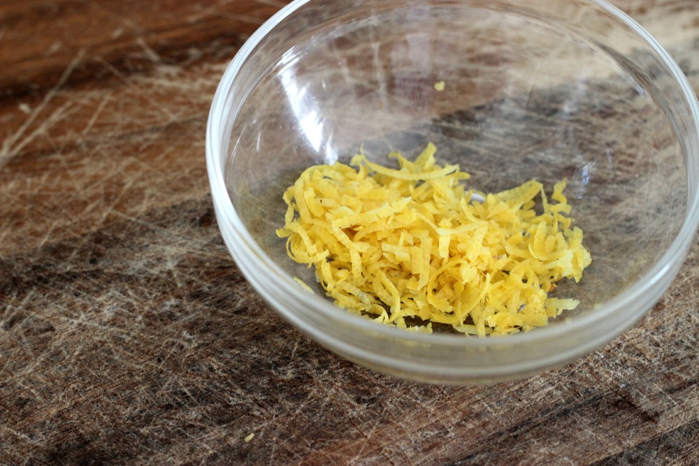 Add lemon zest to whipped cream.