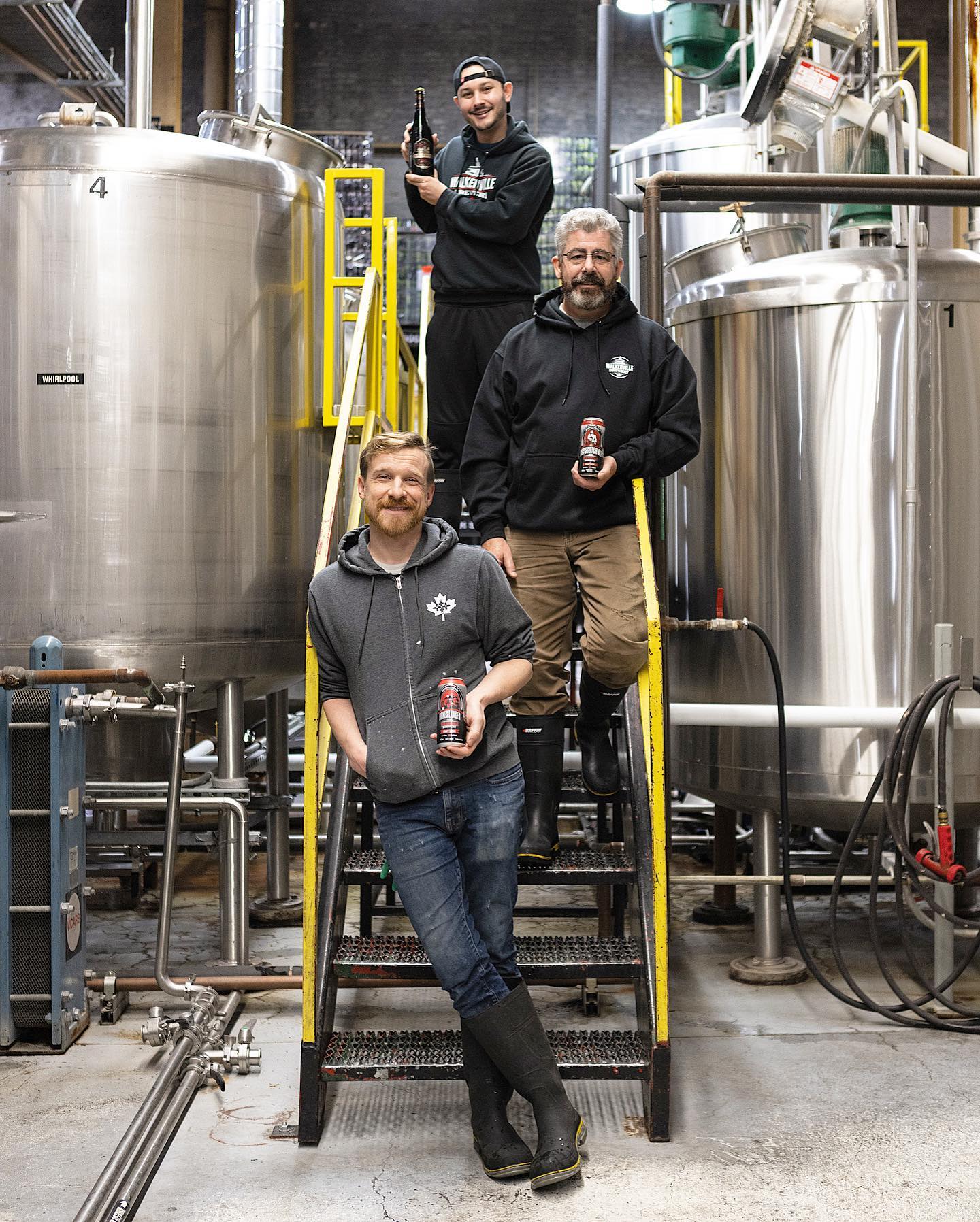 The brewing crew from Walkerville Brewery holding their 2021 Ontario Brewing Awards medal winners.