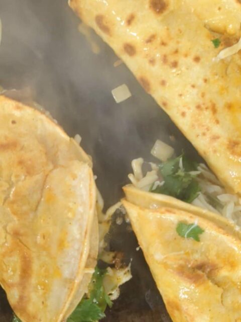 Birria Tacos on the grill at the Rico Taco food truck in Windsor, Ontario.