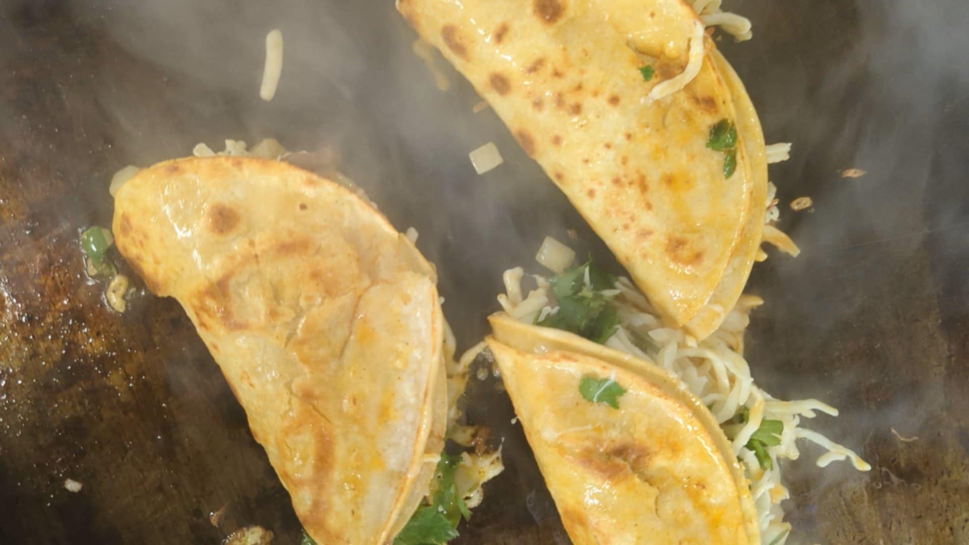 Birria Tacos on the grill at the Rico Taco food truck in Windsor, Ontario.